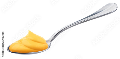 Mayonnaise in spoon isolated on white background, swirl of yellow cheese sauce