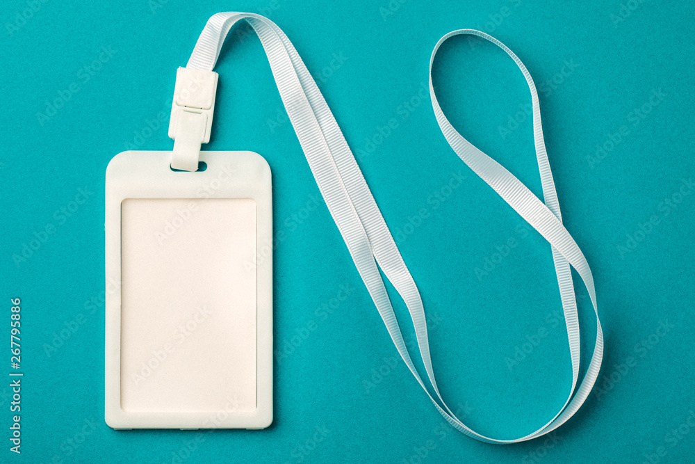 Blank ID card / badge with a white zone on a blue background. Place for text. Blank ID card / badge with a white zone on a blue background. Place for text.