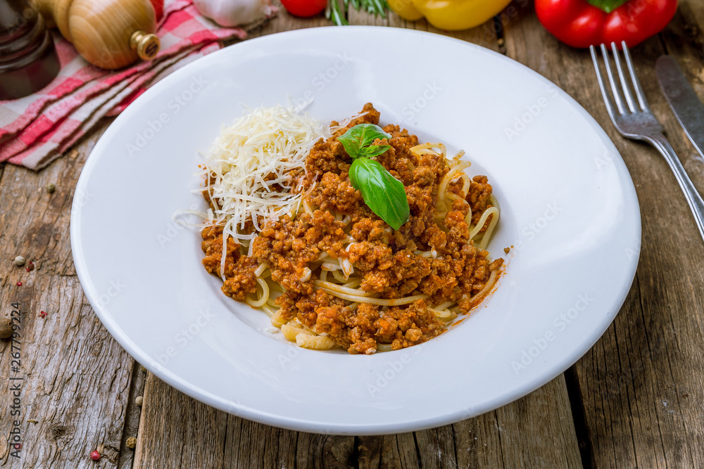 Pasta spaghetti Bolognese on wooden background