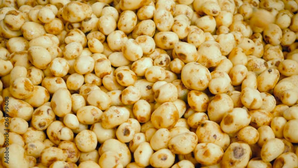 Tubers stored in a metal container at a food factory. Tubers stored in a metal container at a food factory.