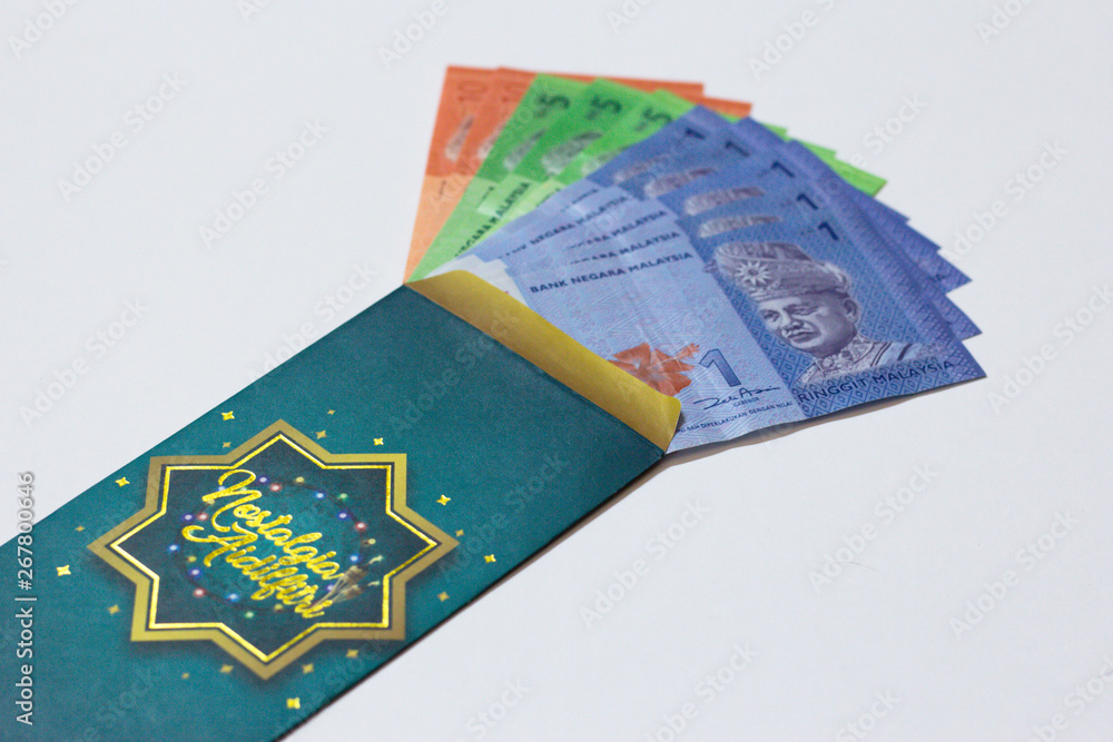 'Duit Raya' is money given from adult to children during Eid al-Fitr ...