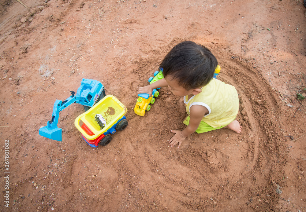 child playing with sand