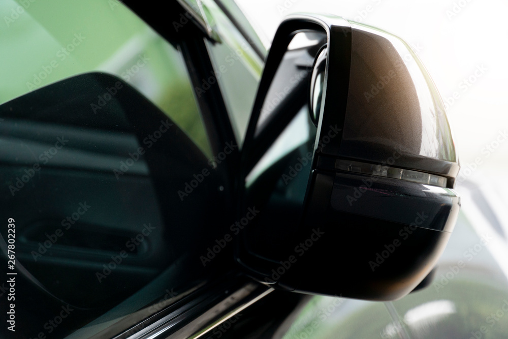 Fototapeta premium The car side mirrors that have been folded when parked.