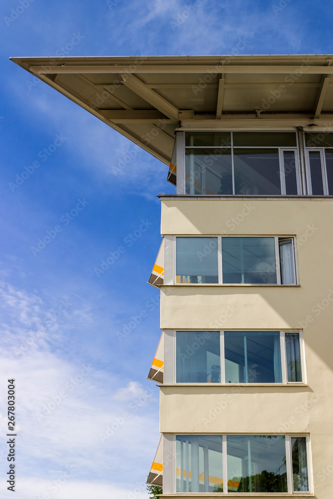 Office facade against a blue sky