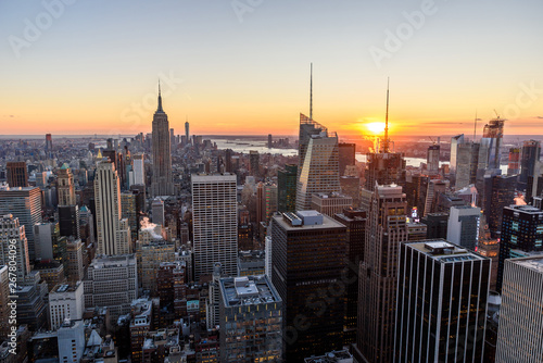 Panorama view of Midtown Manhattan skyline with the Empire State Building from the Rockefeller Center Observation Deck. Top of the Rock - New York City  USA