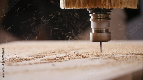 Concept of production and woodworking. Cnc milling machine working, cutting wood