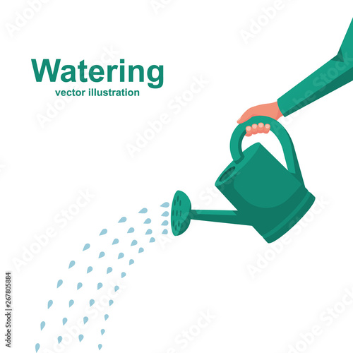 Fotografia Watering can holding in hand