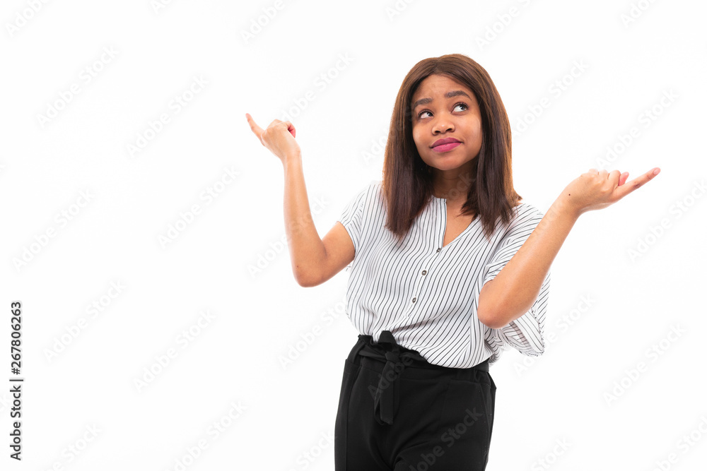 portrait of african young girl possing and gesticulates hands on background portrait of african young girl possing and gesticulates hands on background