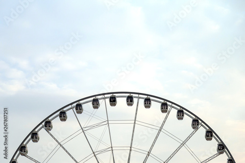 A circle swing with sky and blank for copy space.
