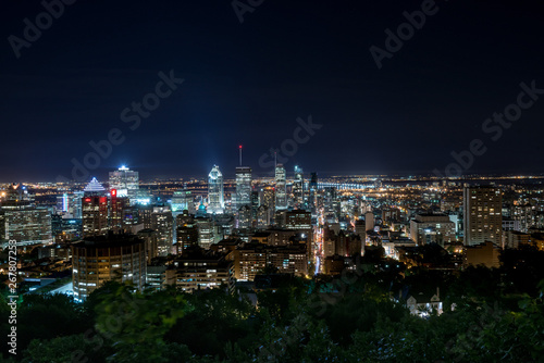 Montreal urban skyline in a summer night with tall skyscarapers and blue sky photo