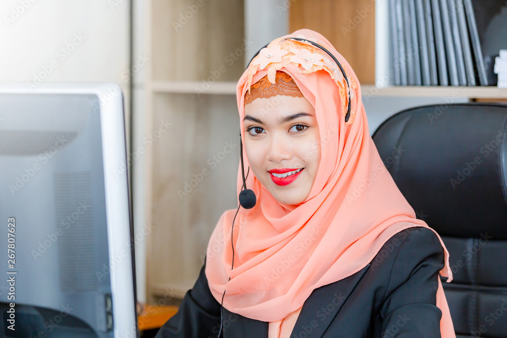Close up of happiness and smiling young beautiful Arab middle eastern businesswoman with headphones, Professional operator service concept