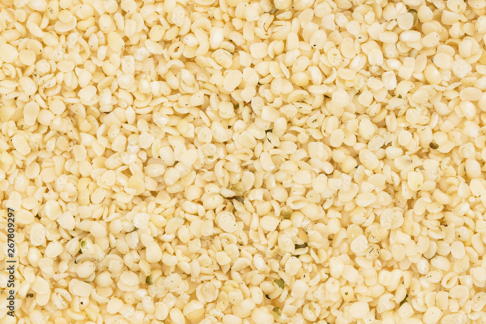 Full frame of shelled or peeled hemp seeds for background Full frame of shelled or peeled hemp seeds for background
