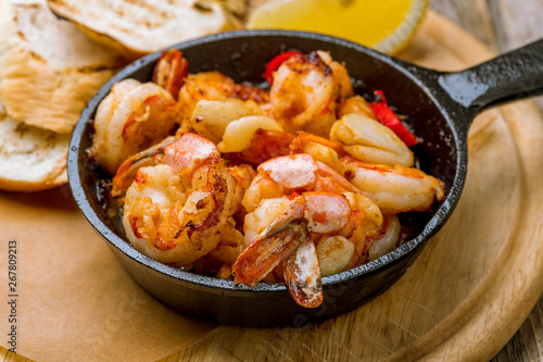 Tiger prawns fried in a cast iron pan