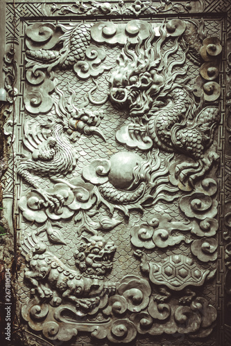 detail of an old stone chinese sculpture door