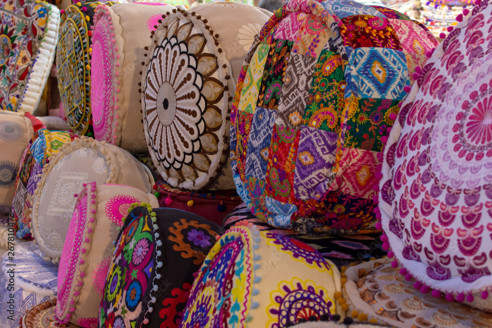 Colourful Indian Pillows lines up for sale in at Global Village Market in Dubai, United Arab Emirates.