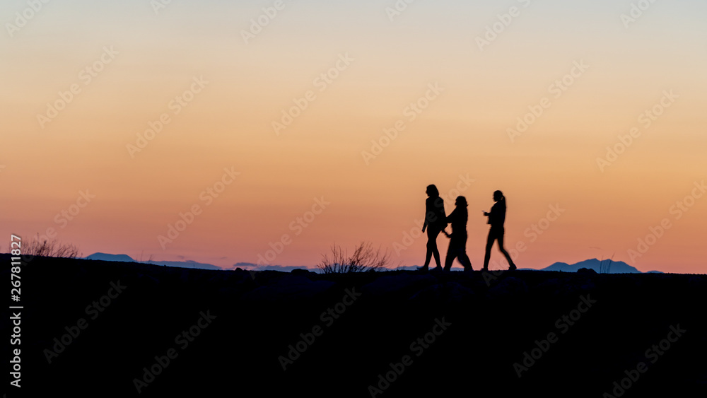 Unidentified people silhouette walking during sunset in Side, Antalya, Turkey