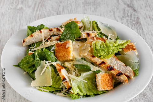 Caesar salad with chicken and cheese