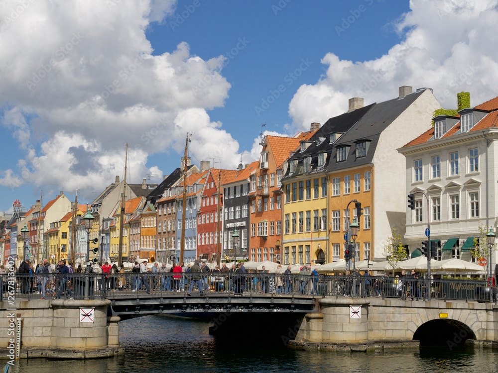 Nyhavn with colorful facades of old houses and old ships in the Old Town of Copenhagen