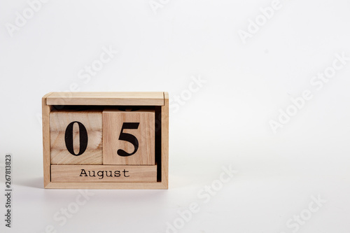 Wooden calendar August 05 on a white background photo