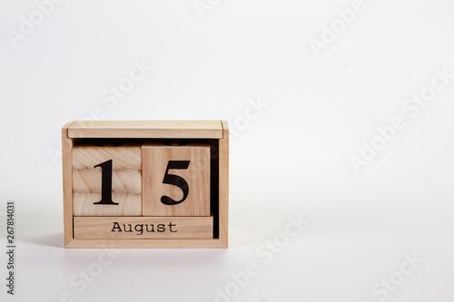 Wooden calendar August 15 on a white background