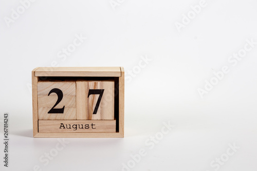 Wooden calendar August 27 on a white background