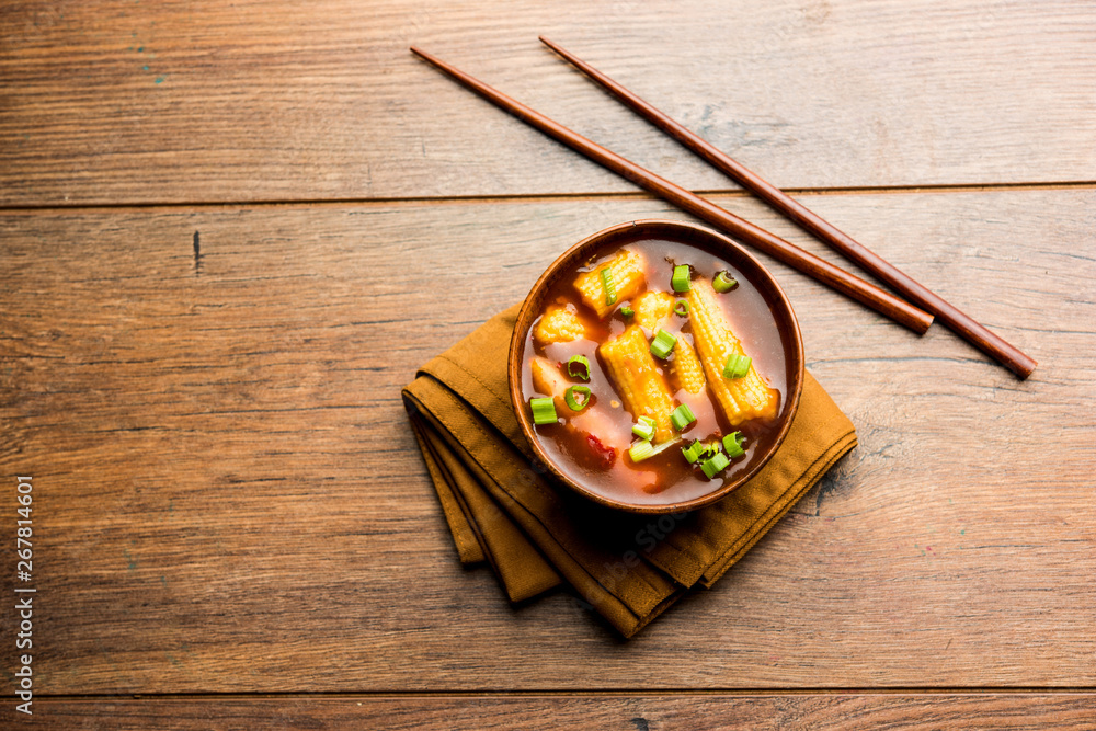 Baby Corn Manchurian with gravy - popular Indo-chinese recipe. selective focus Baby Corn Manchurian with gravy - popular Indo-chinese recipe. selective focus