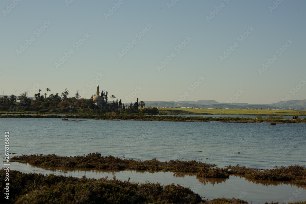 View of the coastline with church, trees and bushes View of the coastline with church, trees and bushes