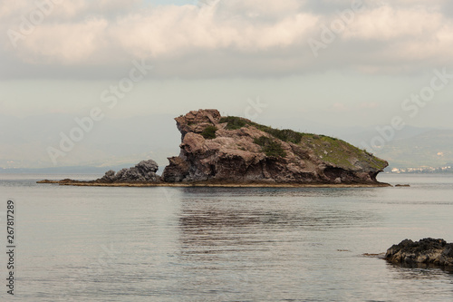 Small rocky island near seashore in Cyprus