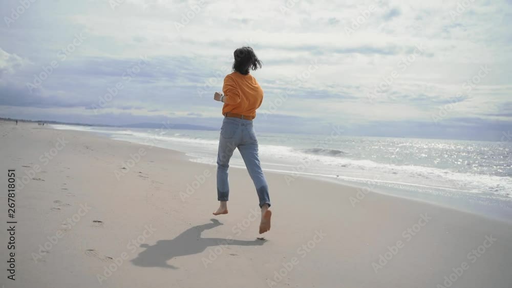 Attractive girl running on the beach in summer Attractive girl running on the beach in summer