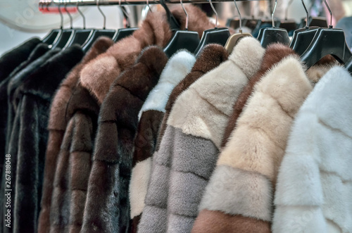 Luxury fur coats on sale. Woman fashion. Selective focus