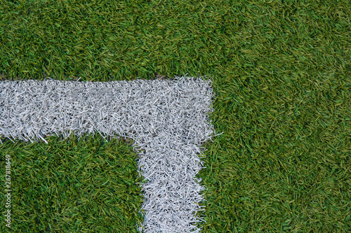 white stripe of a football field with artificial turf