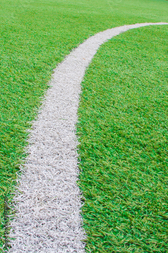 white stripe of a football field with artificial turf