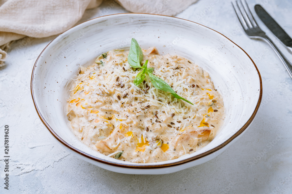 risotto with porcini mushrooms on white plate risotto with porcini mushrooms on white plate