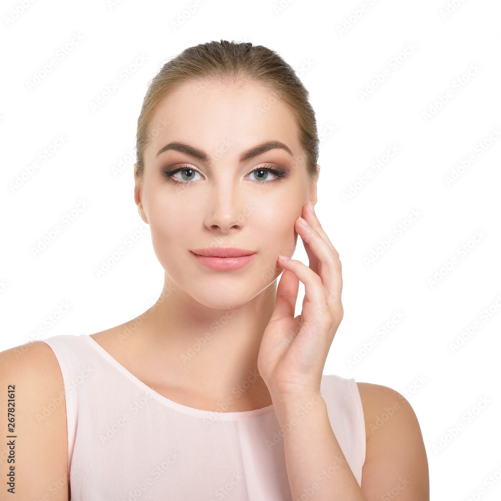 Beauty female portrait. Young attractive woman posing at studio over white background. Beautiful girl. Model with perfect make-up Beauty female portrait. Young attractive woman posing at studio over white background. Beautiful girl. Model with perfect make-up