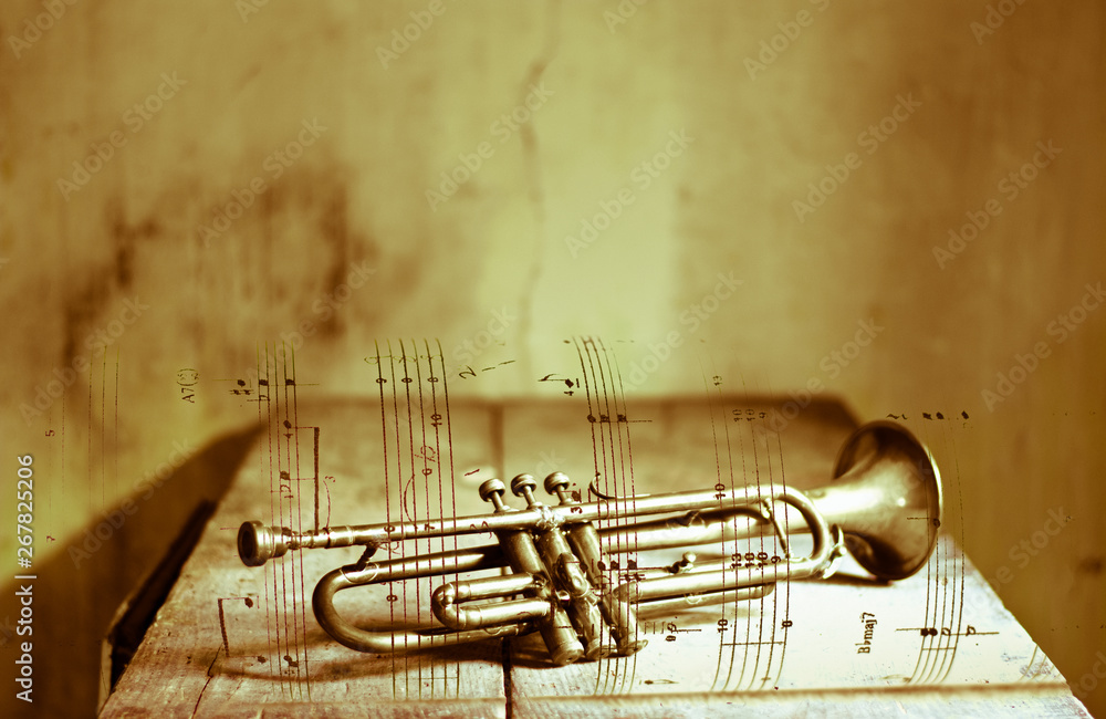Naklejka premium old trumpet on sheet music