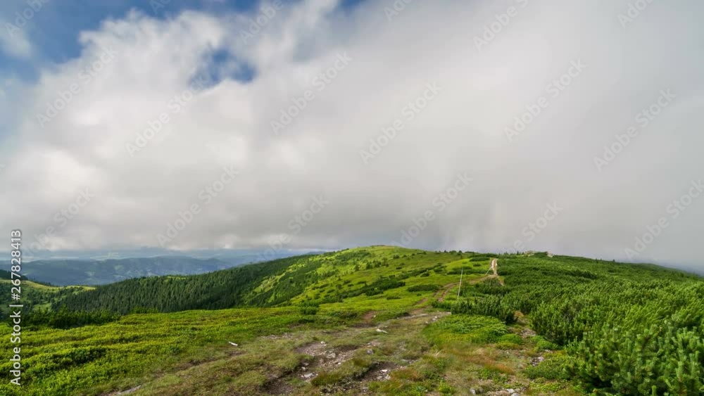 Clouds motion over green Carpathian mountains ridge in sunny summer nature time lapse Clouds motion over green Carpathian mountains ridge in sunny summer nature time lapse