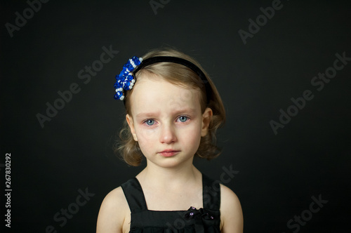 Emotional child with tears - a young girl crying, fine art portrait