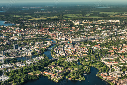 old town Berlin Spandau with town hall, train station and "Spandau Arcaden" in front, with the river Havel and Wannsee in the background