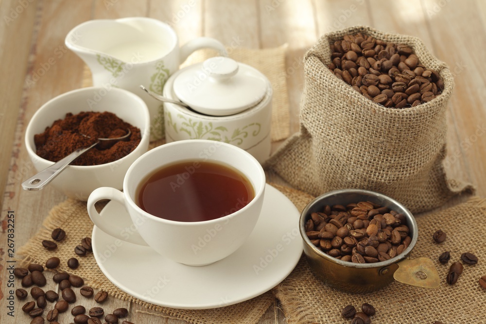Cup of coffee, coffee beans and ground coffee Cup of coffee, coffee beans and ground coffee