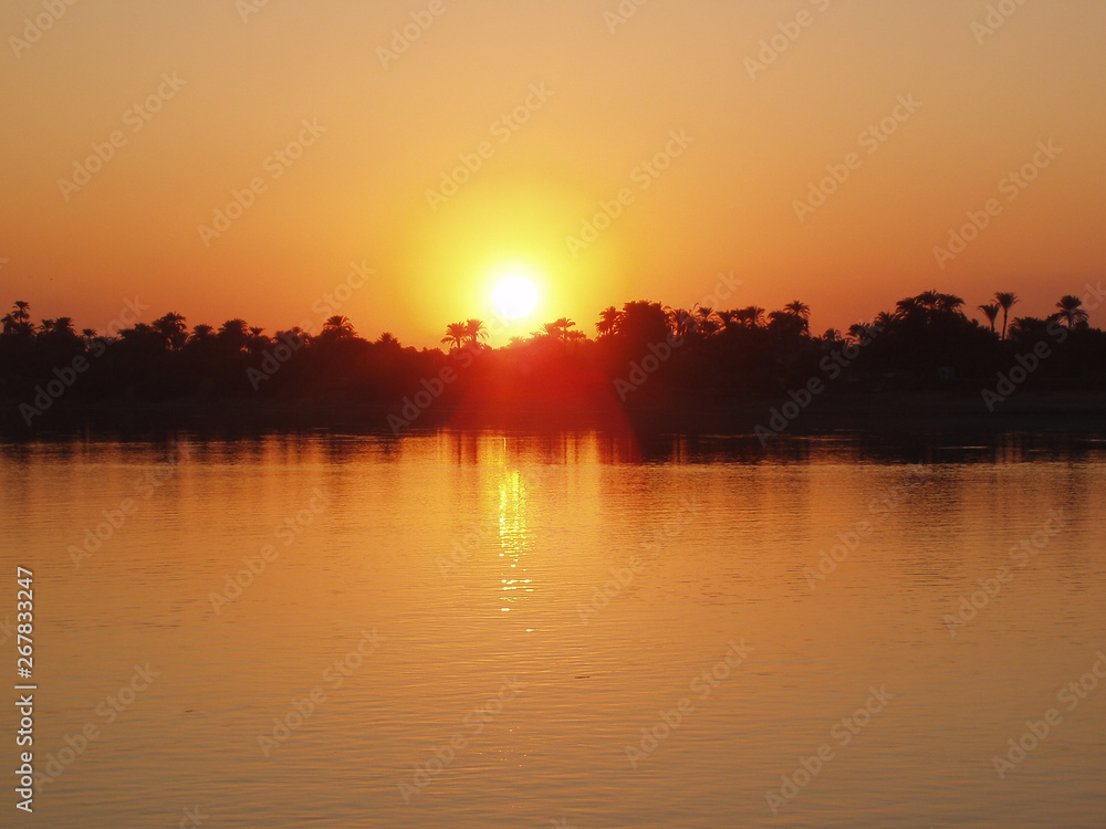 Boat in Nile river during sunset in Luksor, Egypt