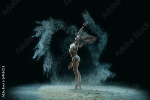 Slim girl in lingerie in dust profile shot