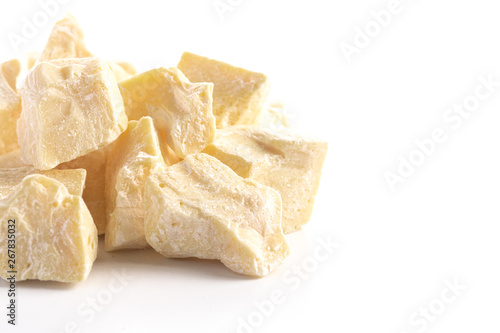 Chunks of Raw Organic Cocoa Butter on a White Background