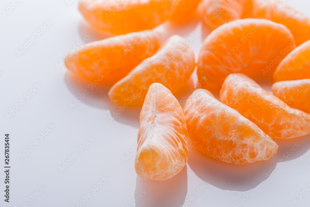 juicy mandarin on a white acrylic background juicy mandarin on a white acrylic background