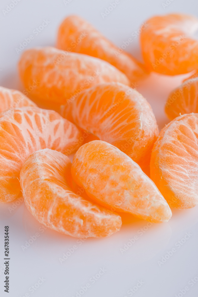 juicy mandarin on a white acrylic background juicy mandarin on a white acrylic background