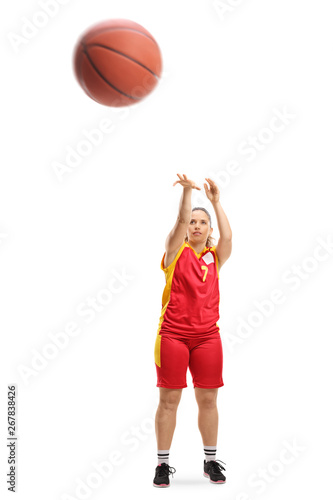 Female player shooting a basketball