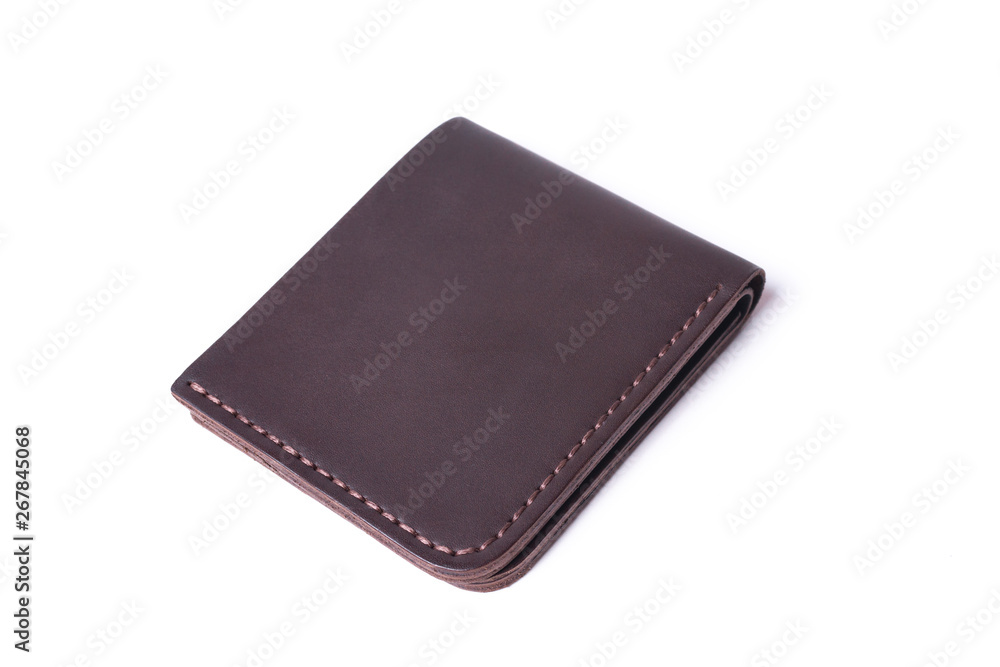 Brown handmade leather man wallet isolated on white background. Wallet is closed. Stock photo of luxury businessman accessories. Brown handmade leather man wallet isolated on white background. Wallet is closed. Stock photo of luxury businessman accessories.