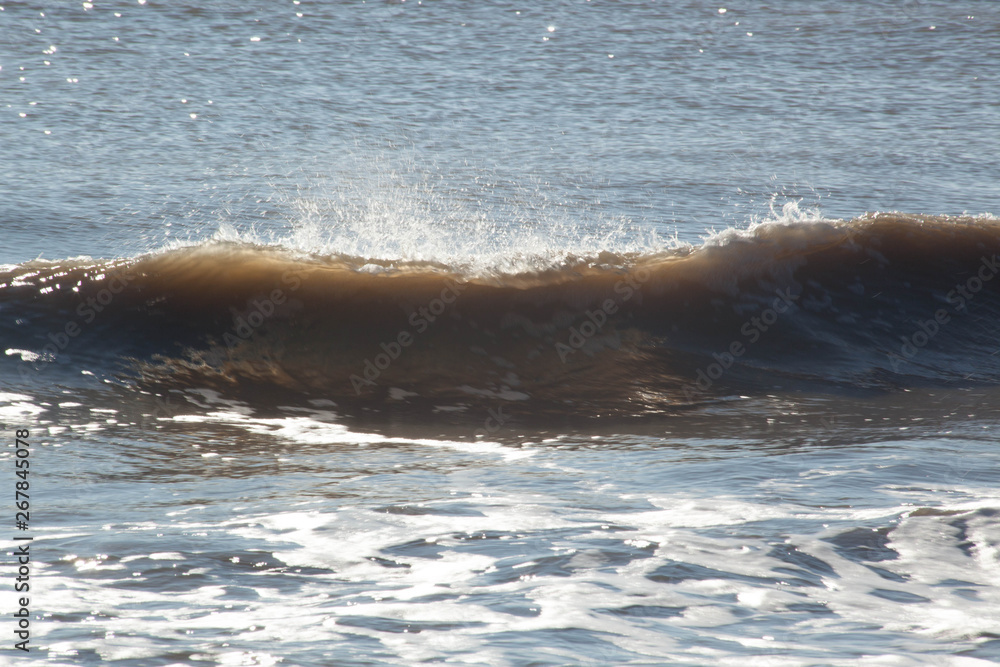 Ocean waves crashing onto the shore