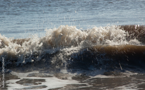 Ocean waves crashing onto the shore © Allen Penton