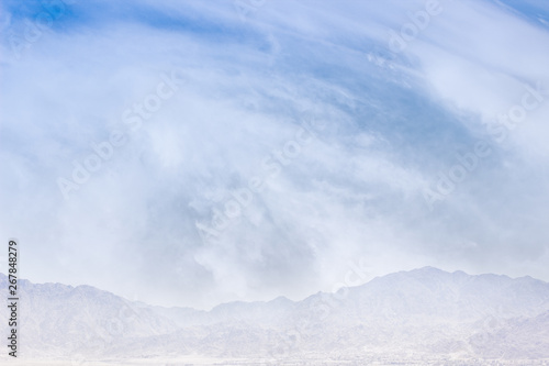 abstract nature winter foggy mountain silhouette in white clouds scenic cold highland morning landscape