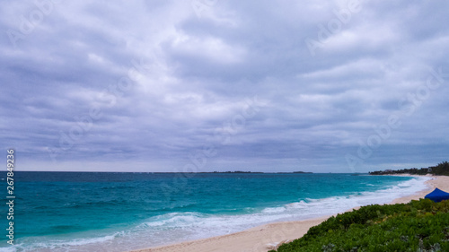Cloudy day over a beach in Nassau and a view of the Atlantic Ocean. Paradise Island  The Bahamas.